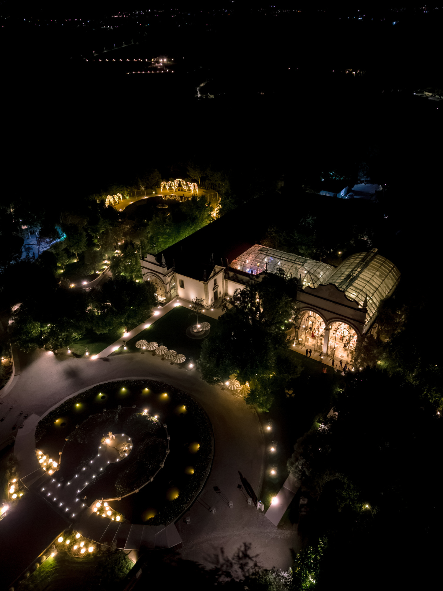 Aerial night view of Solar da Levada, its gardens and buildings softly lit